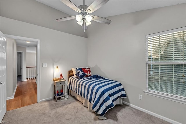 carpeted bedroom featuring ceiling fan