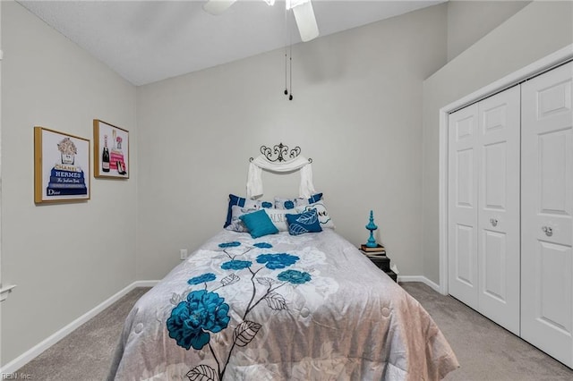 carpeted bedroom with ceiling fan and a closet