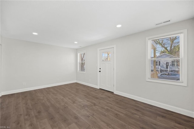 foyer entrance with dark wood-type flooring