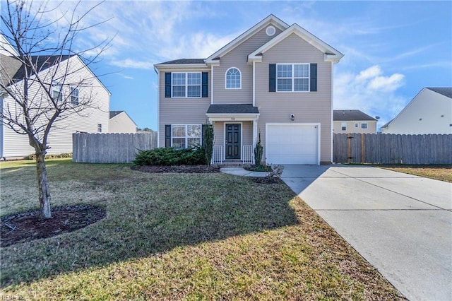 view of front property featuring a garage and a front yard