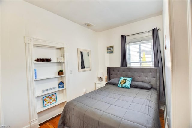 bedroom with hardwood / wood-style floors