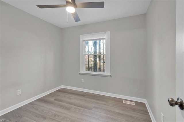 spare room with ceiling fan and light hardwood / wood-style flooring