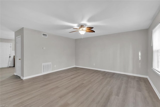 spare room with ceiling fan and light hardwood / wood-style flooring