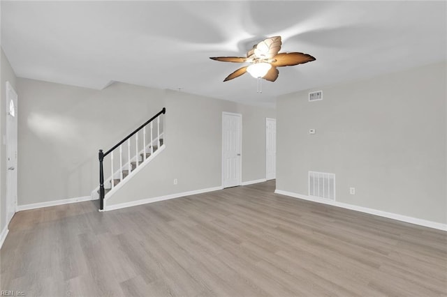 unfurnished living room with light hardwood / wood-style flooring and ceiling fan