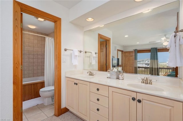 full bathroom with tile patterned floors, toilet, shower / tub combo, vanity, and ceiling fan