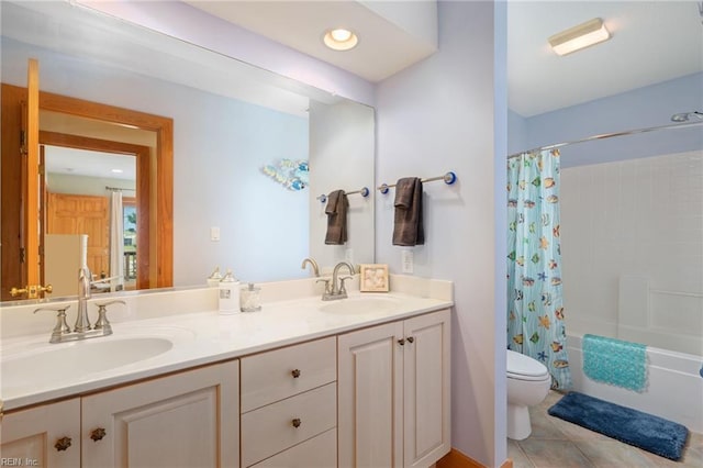 full bathroom with vanity, shower / tub combo with curtain, tile patterned floors, and toilet