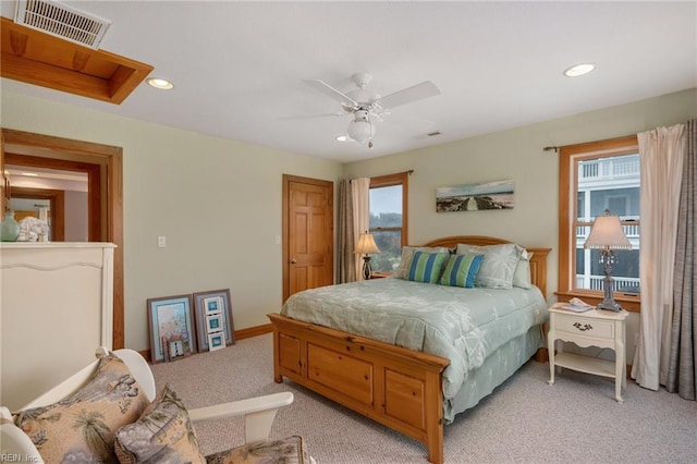 bedroom with light carpet and ceiling fan