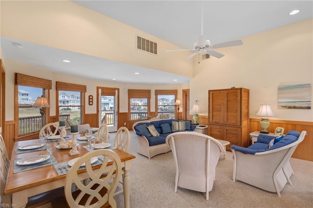 living room featuring light colored carpet and ceiling fan