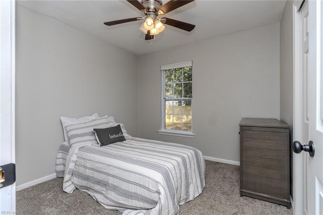 bedroom featuring ceiling fan and light colored carpet