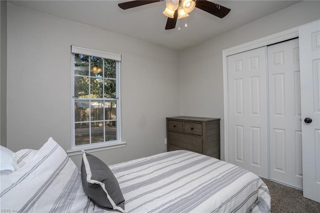 bedroom with carpet, ceiling fan, and a closet