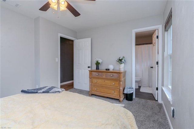 carpeted bedroom with connected bathroom and ceiling fan