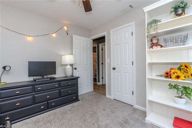 carpeted bedroom featuring ceiling fan