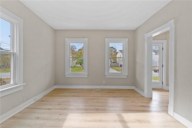 spare room featuring light hardwood / wood-style floors