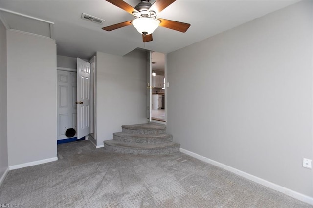 interior space with ceiling fan and carpet floors