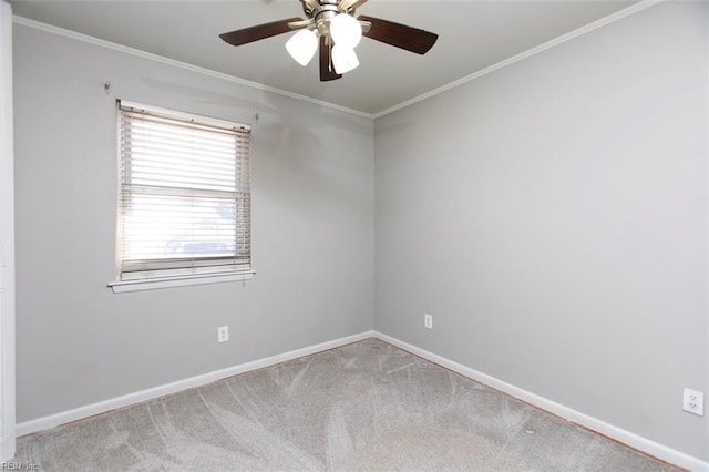 carpeted empty room featuring crown molding and ceiling fan