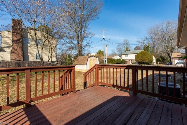 deck with cooling unit and a storage shed