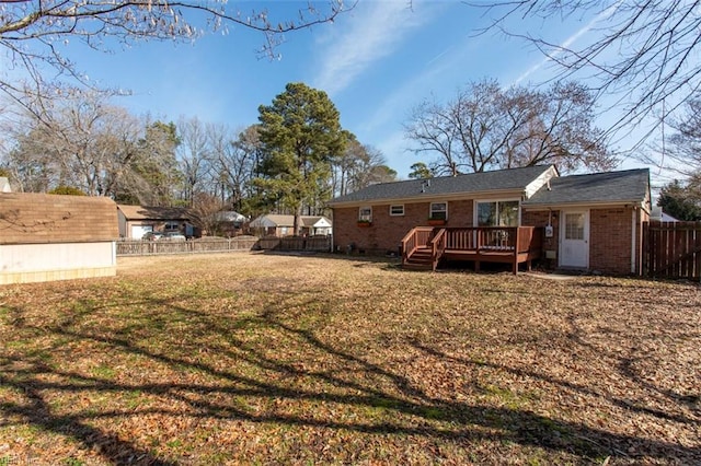 view of yard with a shed and a wooden deck