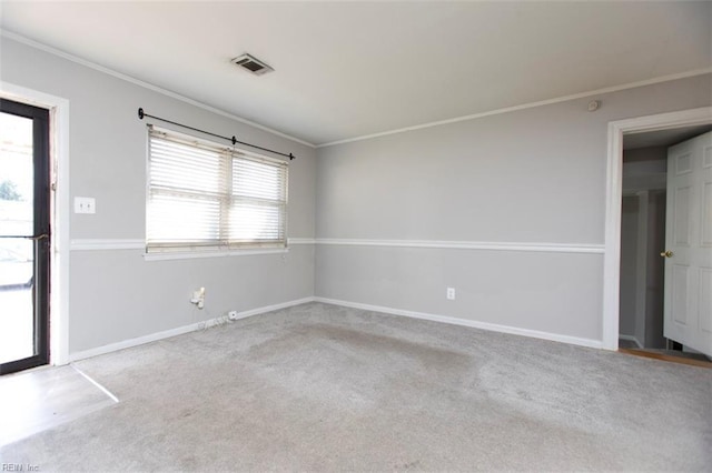 carpeted empty room featuring ornamental molding