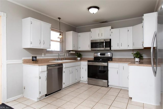 kitchen with white cabinetry, hanging light fixtures, crown molding, and stainless steel appliances