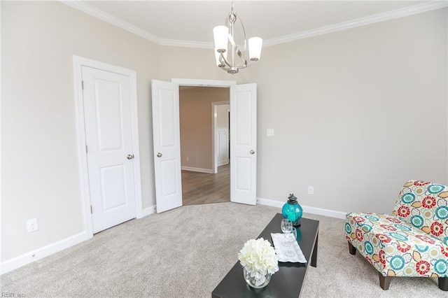 sitting room with crown molding, carpet flooring, and a notable chandelier