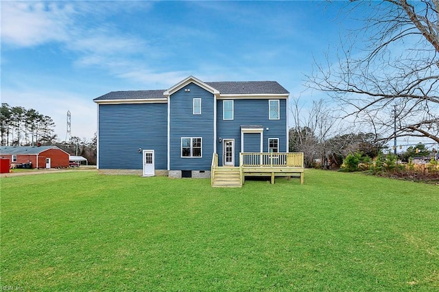 back of house with a wooden deck and a lawn