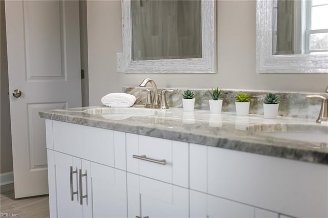 bathroom with vanity and hardwood / wood-style floors