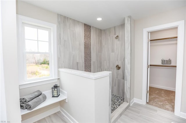 bathroom with tiled shower