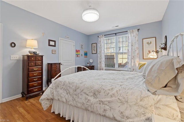 bedroom featuring hardwood / wood-style floors