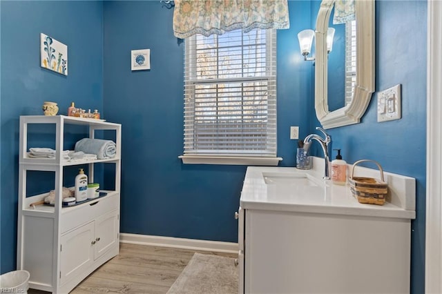 bathroom with wood-type flooring and vanity