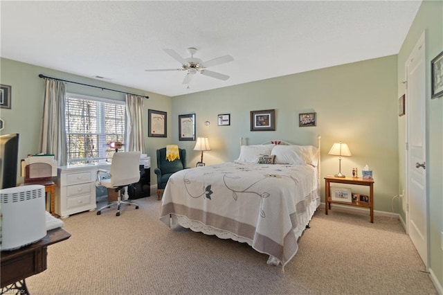 bedroom featuring light carpet and ceiling fan