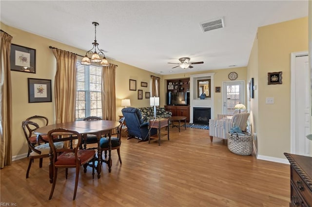 dining room featuring ceiling fan and light hardwood / wood-style flooring