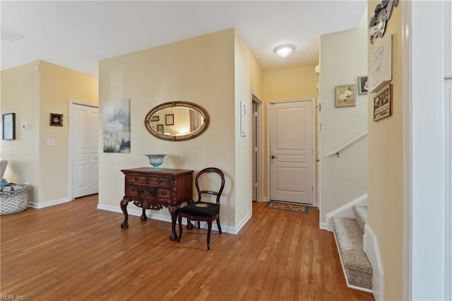 hall with light hardwood / wood-style floors