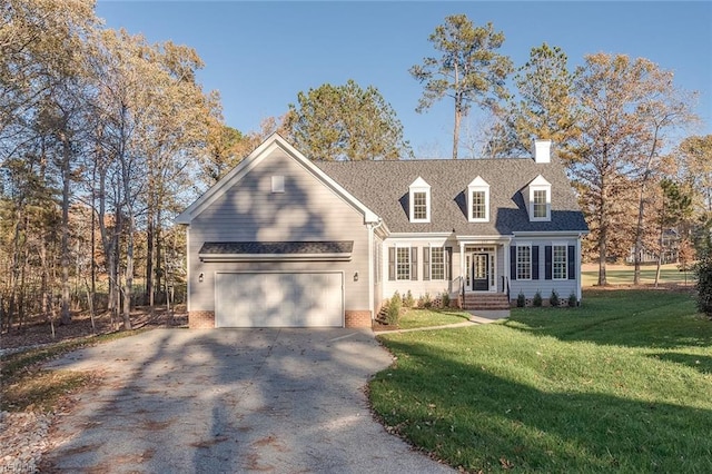 view of front of house with a garage and a front yard