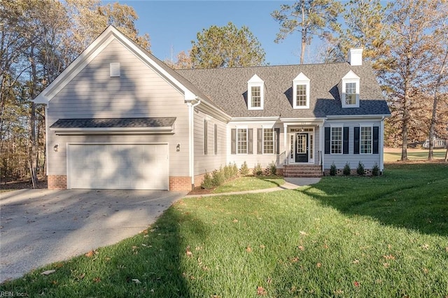 cape cod-style house featuring a garage and a front lawn