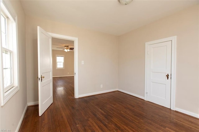 empty room featuring dark hardwood / wood-style flooring