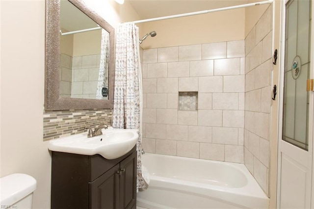 full bathroom featuring shower / bath combination with curtain, vanity, toilet, and decorative backsplash