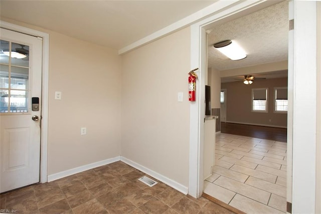 interior space featuring a textured ceiling