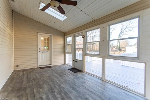 unfurnished sunroom with lofted ceiling with skylight and ceiling fan