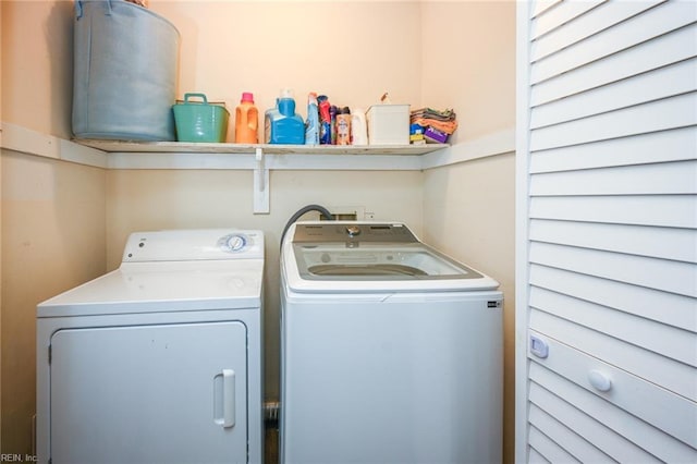 laundry area with washer and clothes dryer