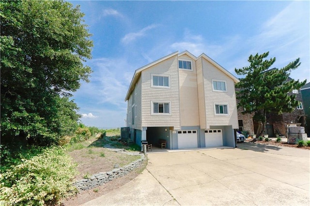 view of side of property with a garage