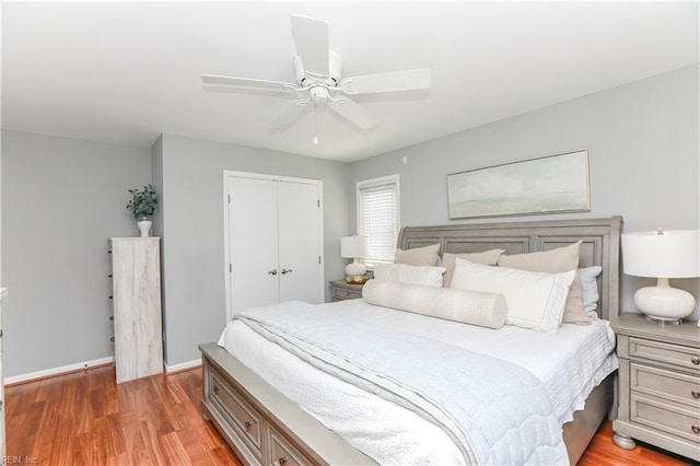 bedroom featuring hardwood / wood-style flooring, a closet, and ceiling fan