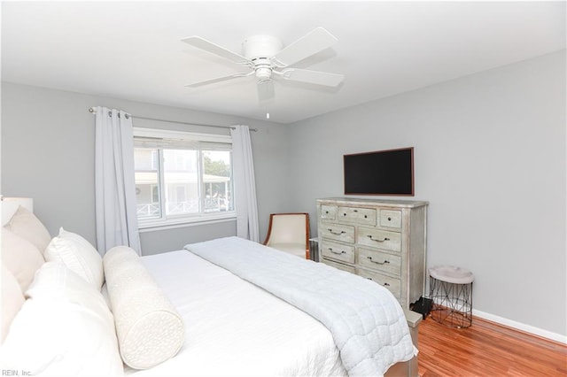 bedroom featuring ceiling fan and light hardwood / wood-style floors