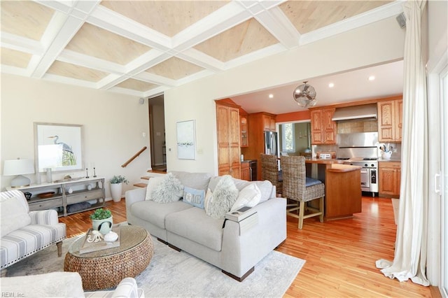 living room featuring beamed ceiling, coffered ceiling, and light wood-type flooring