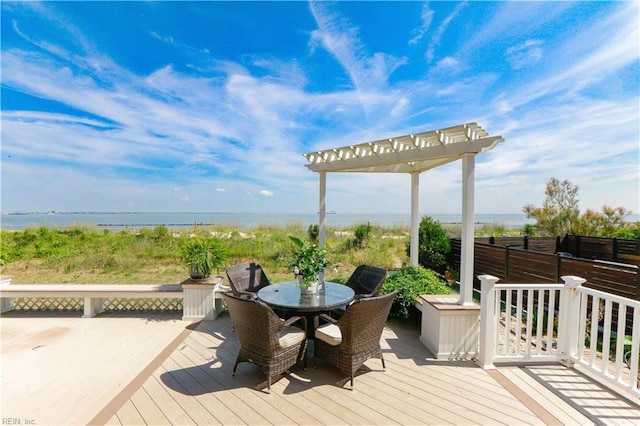 wooden terrace featuring a water view