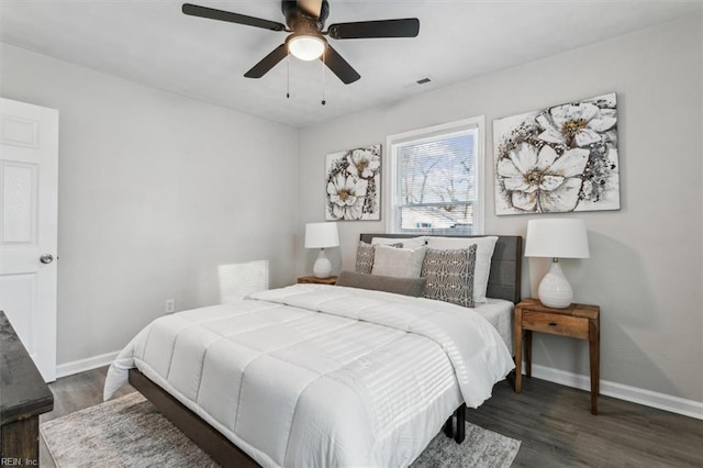 bedroom featuring dark hardwood / wood-style flooring and ceiling fan