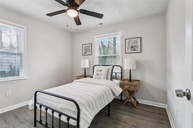 bedroom featuring dark wood-type flooring and ceiling fan