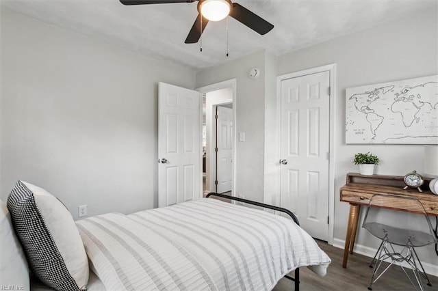 bedroom featuring hardwood / wood-style flooring and ceiling fan