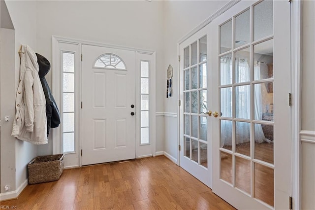 entrance foyer featuring french doors and hardwood / wood-style floors