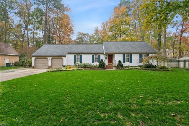 ranch-style house with a garage and a front yard