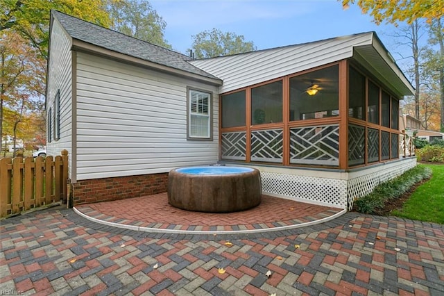 back of house with a patio and a sunroom